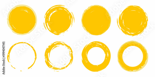 Eight yellow oval brush strokes arranged on a plain white background