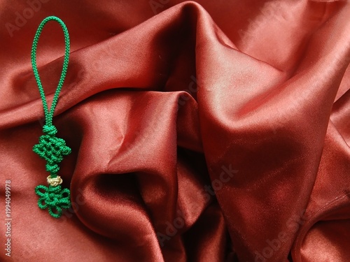 Canvas-taulu Traditional Korean handmade colorful knots decoration on undulating satin wrappi