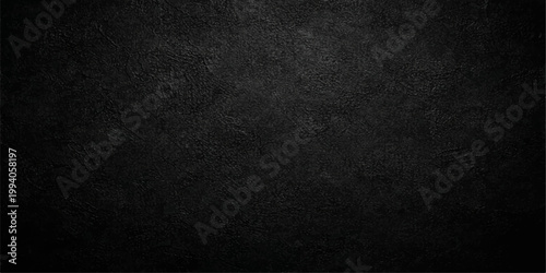 A dark black grunge background featuring a rough textured surface of old leather material and gray paper pattern for a macro design backdrop