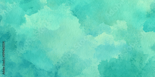 Teal watercolor background with soft greenish hues and abstract cloudy texture for design and artistic projects