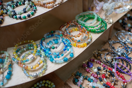 Colorful gemstone bracelets display in market shop