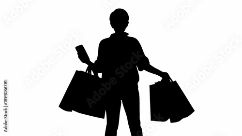 Black silhouette of a person holding shopping bags and phone outdoors