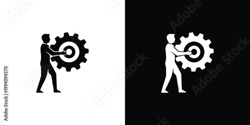 Black and white silhouettes of man turning gearwheel with target in center