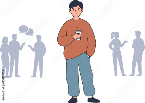 A man stands alone holding a drink while others talk nearby.