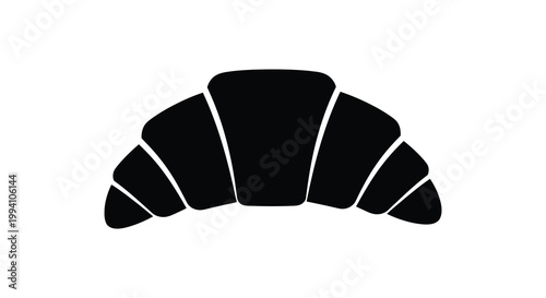 A simple black silhouette of a flaky golden brown croissant design silhouette