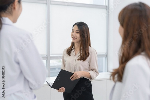 two businesswomen working together in office