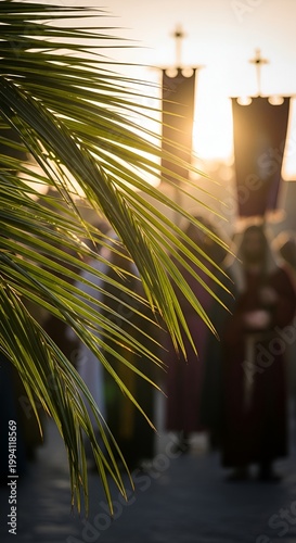 Palm Sunday religious procession with palm leaf in the foreground at sunset.