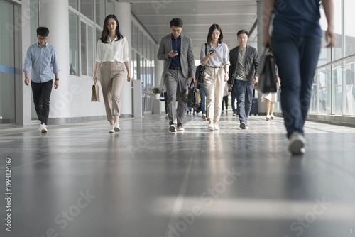 group of people walking in the airport