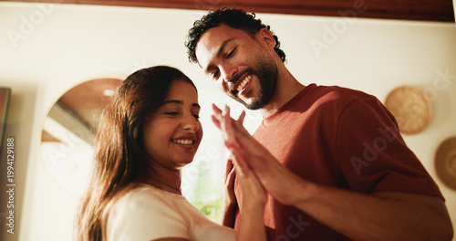 Obraz na plátně Happy, couple and holding hands in home with love, romantic connection or bonding together on weekend
