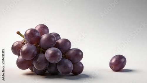 Bunch of Fresh Red Grapes with Single Grape on Side