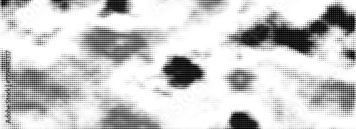 Grunge overlay of scattered black dots with a classic vintage halftone effect.