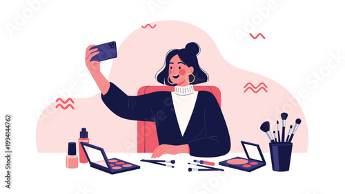 Content woman taking a selfie at her vanity table surrounded by various makeup products like brushes eyeshadow palettes and nail polish.