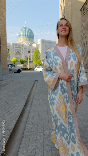 Woman in Uzbek robe at Center of Islamic Civilization Tashkent