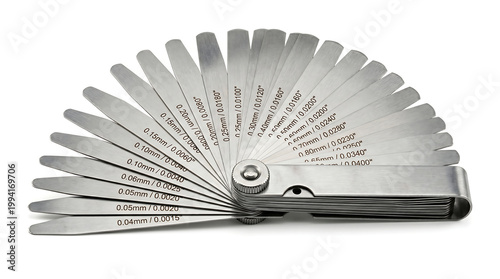 A set of automotive feeler gauges, used for measuring clearances between parts, displayed in a fan-like pattern against a white background