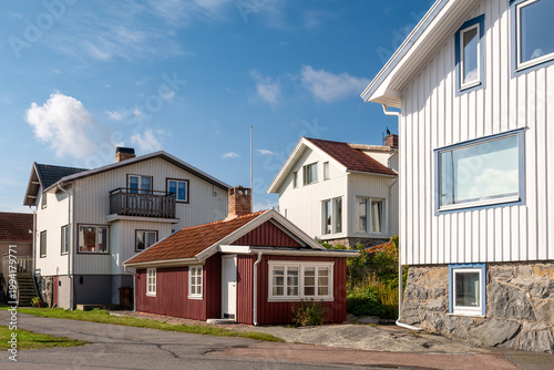 Street scene with residential houses on Källö-Knippla island in northern Gothenburg archipelago, Bohuslän, west coast Sweden