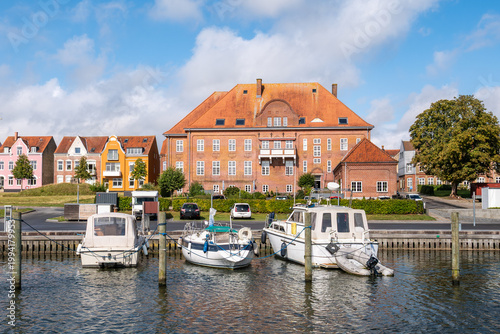 Den gamle toldbod, old customs house, and historic houses on Skibbrogade with boats in harbour of Haderslev, South Jutland, Southern Denmark