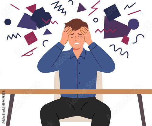 A frustrated man sits at a desk with hands on head surrounded by chaotic shapes