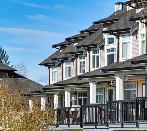 Row of nice residential townhouses on winter day in British Columbia, Canada