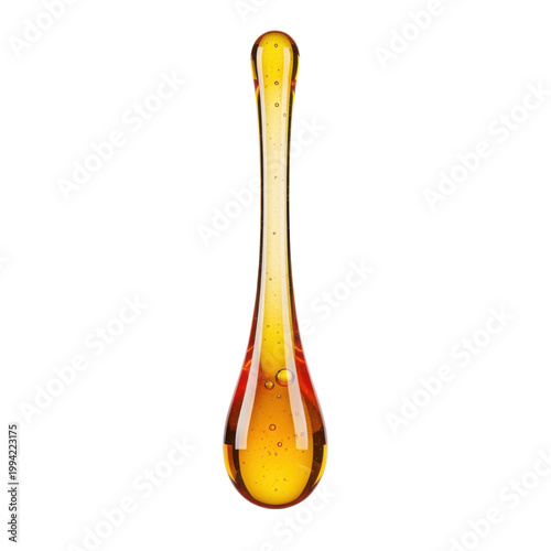 Single drop of honey or viscous golden liquid falling isolated on white background