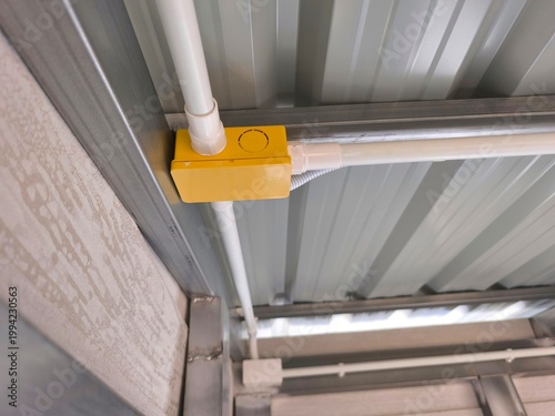 PVC pipe and junction box routing for electrical system and structure.