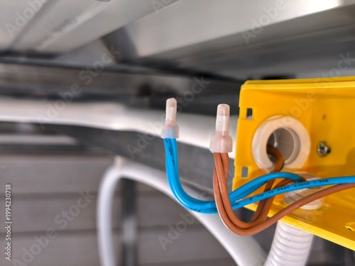 Connection point of electric cable with wire nuts in box point the structure wall