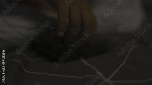 Toddler Picks Up Seaweed Sheet With Fingers, A charming video of a toddler curiously picking up a seaweed sheet with tiny fingers, perfect for family lifestyle documentary and food.