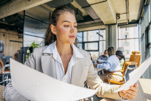 Photos Executive evaluates marketing strategies in bright office