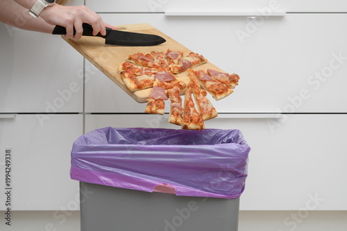 Throwing food in the trash, unappetizing greasy pizza