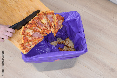 Bild auf Leinwand buying too much food and throwing the excess away, overeating