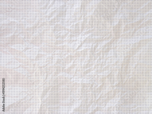 Halftone crumpled paper texture with a dotted, rough, and wrinkled surface. Black creased sheet background in comic pop-art style, featuring grainy folds and gritty distressed -