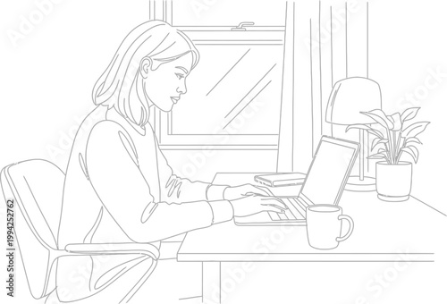 A focused young woman works diligently on her laptop computer while seated at a desk in a well-lit room.