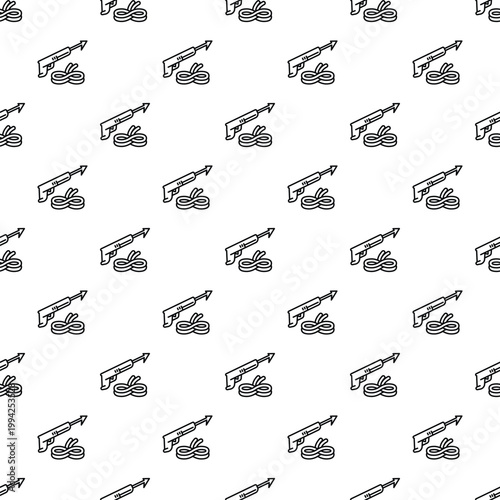 Speargun with a coil of rope repeating in a seamless pattern design