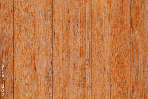 Vertical orange brown wood plank texture background with fine grain