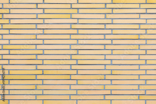 Modern light yellow long brick wall texture background surface