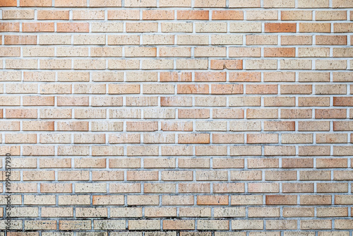 Modern light beige brick wall texture background with copy space