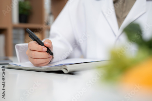 Close up asian nutritionist consulting patient in clinic, meal plan discussion, healthcare advice, weight loss support, doctor talking and explaining patient for nutrition consultation, wellness care.