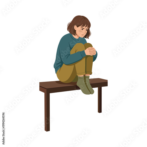 A young girl sits on a wooden bench looking down sadly