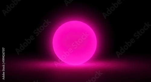 A bright pink glowing orb shines in a dark room with a subtle light effect on the floor.