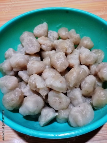 Obraz na plátně Cilok or pentol in a green bowl—a popular Indonesian snack made from tapioca flour or a meat mixture