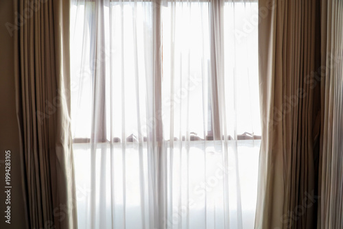 Beautiful curtain with sunlight in a room,White translucent curtains