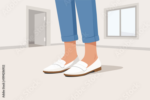 Human legs wearing jeans and white loafers, standing in an empty room looking for an apartment to rent
