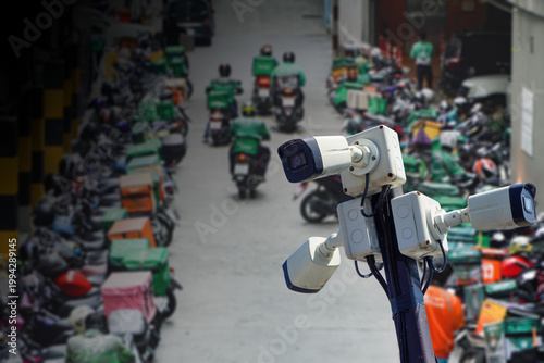 CCTV security system or closed-circuit television in shopping mall motorcycle parking area.