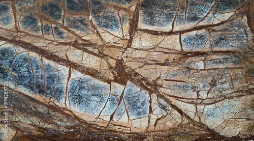 Abstract multicolored background with a texture resembling natural stone.