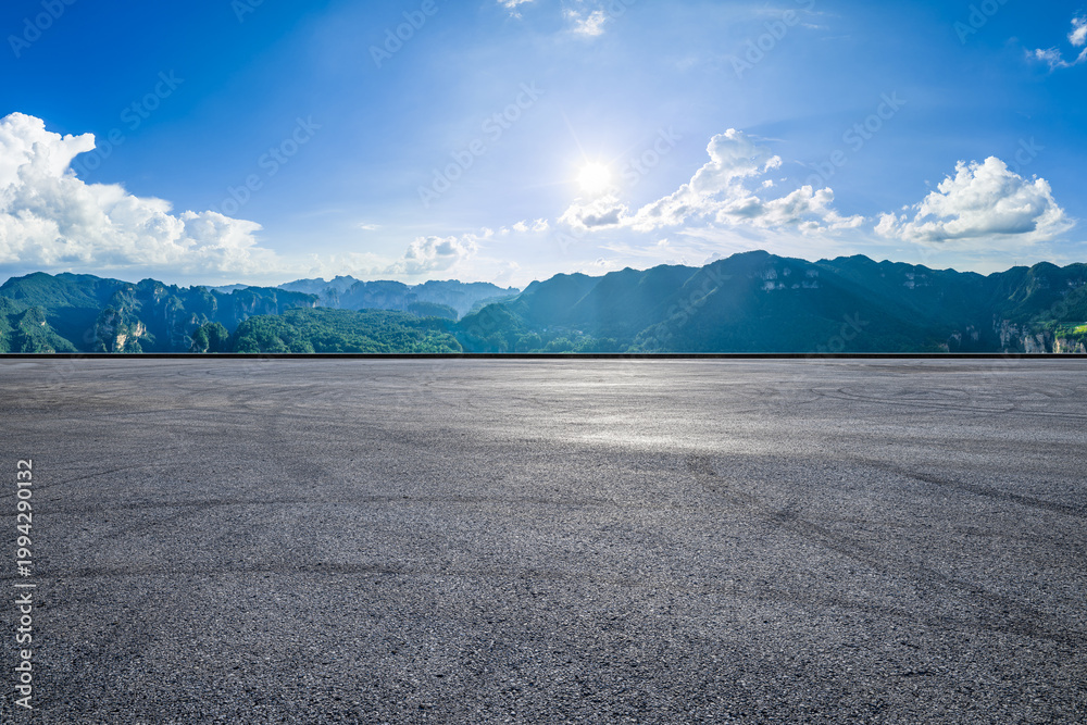 Fototapeta premium Empty asphalt road and majestic mountain landscape in Zhangjiajie, Hunan, China. Road trip and travel concept.