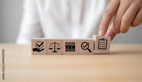 Business checklist document icon selected from wooden blocks.