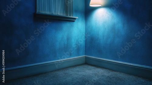 Empty room with blue walls, soft lighting, and a single lamp illuminating the corner creating a serene atmosphere