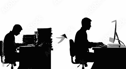 Silhouette of two professionals working at office desks with computers and paperwork in low light
