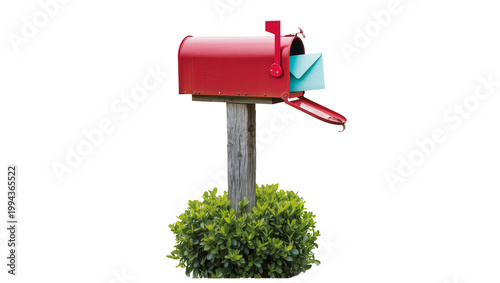 Fotografie Red metal mailbox with envelope and green shrubbery at base