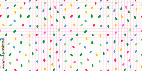 Colorful confetti sprinkles scattered across a light pink grid background