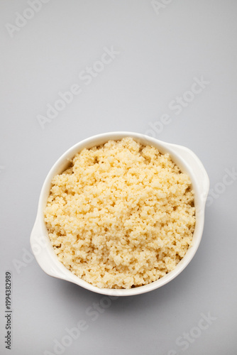 bowl of boiled rice on gray background